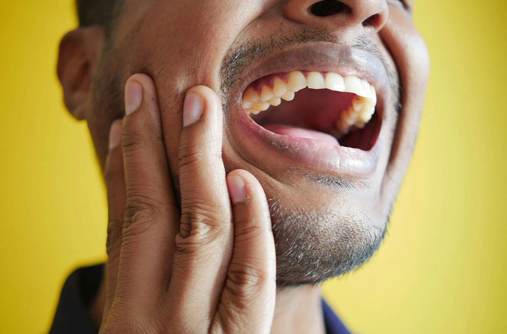 a man Experiencing intense dental pain